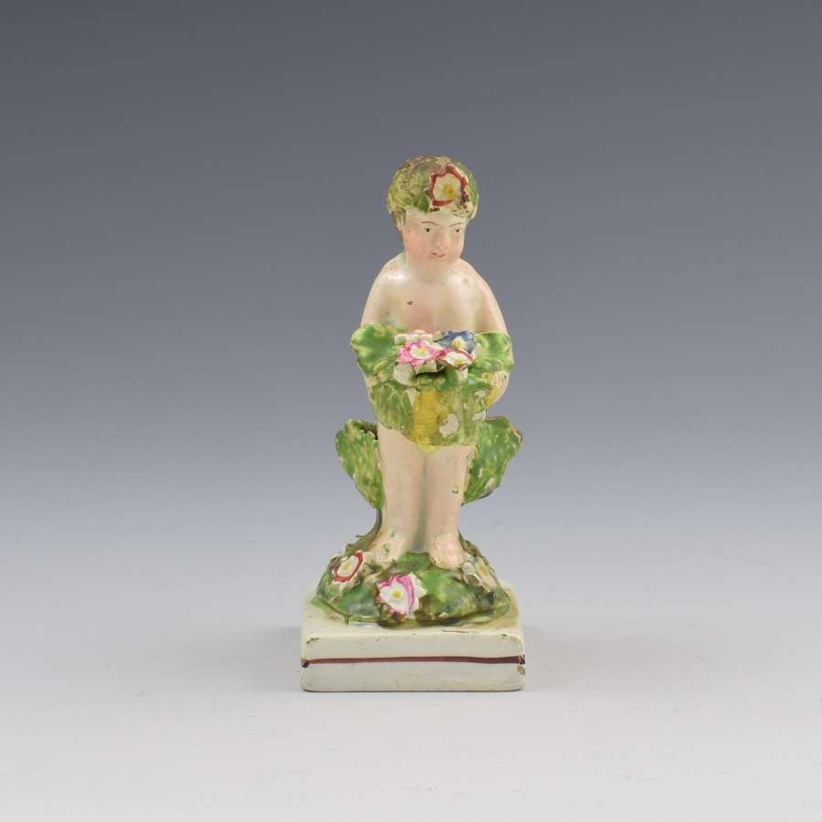Early Staffordshire Pearlware Figure Of A Putto With Basket c.1800